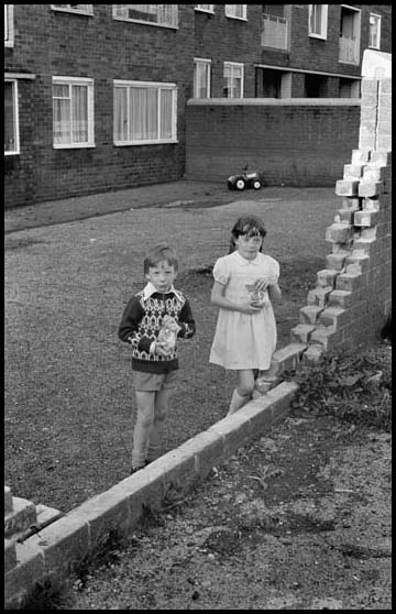 boy & girl eating crisps
